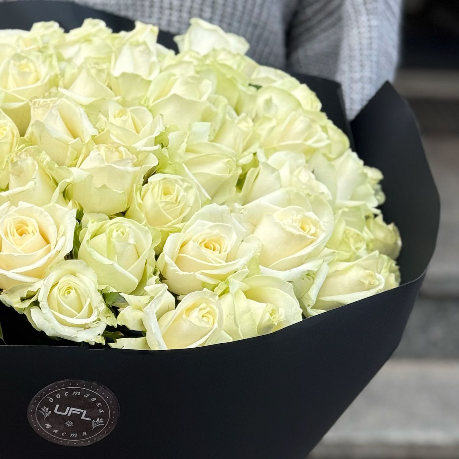 51 white roses in black wrapping 196 $