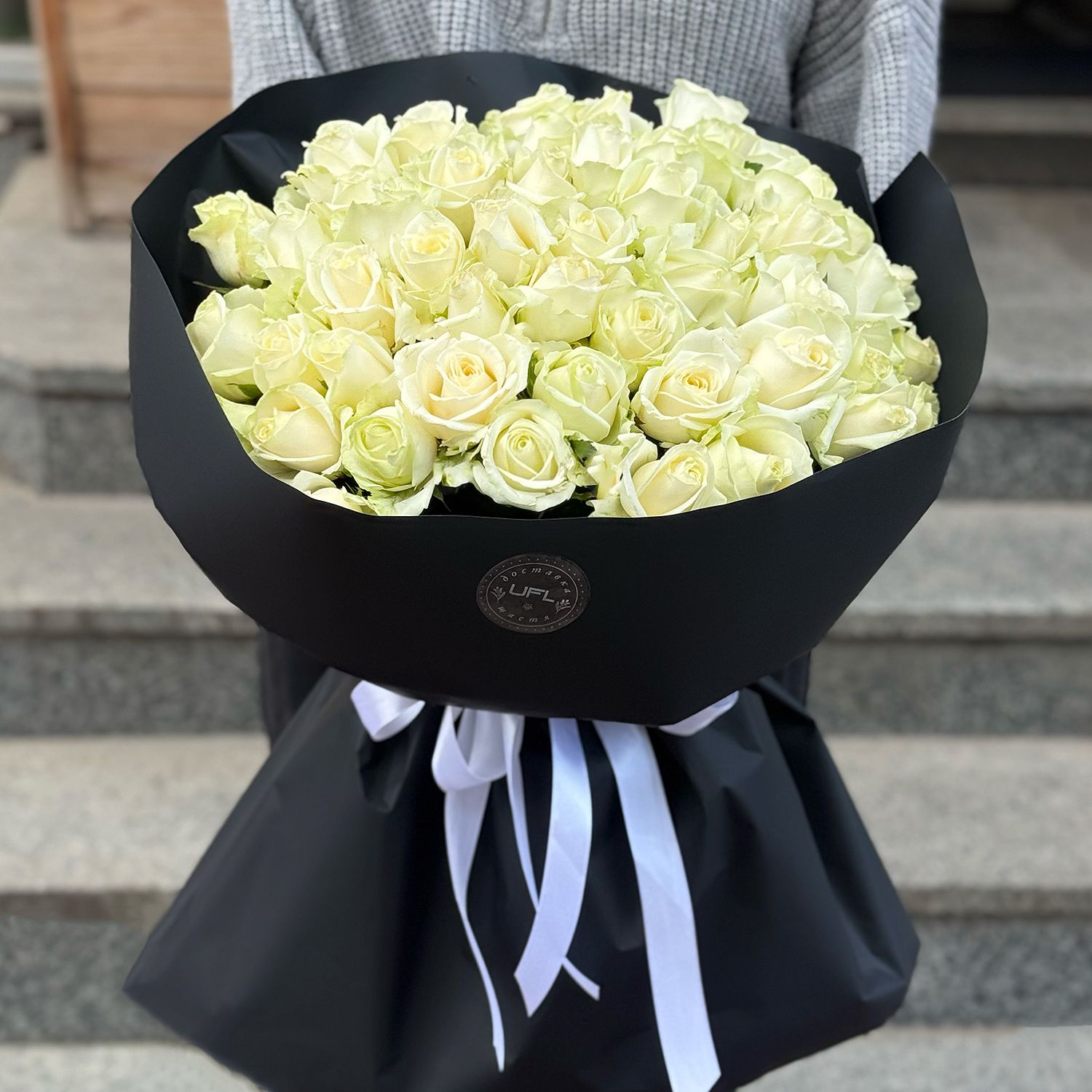 51 white roses in black wrapping 196 $