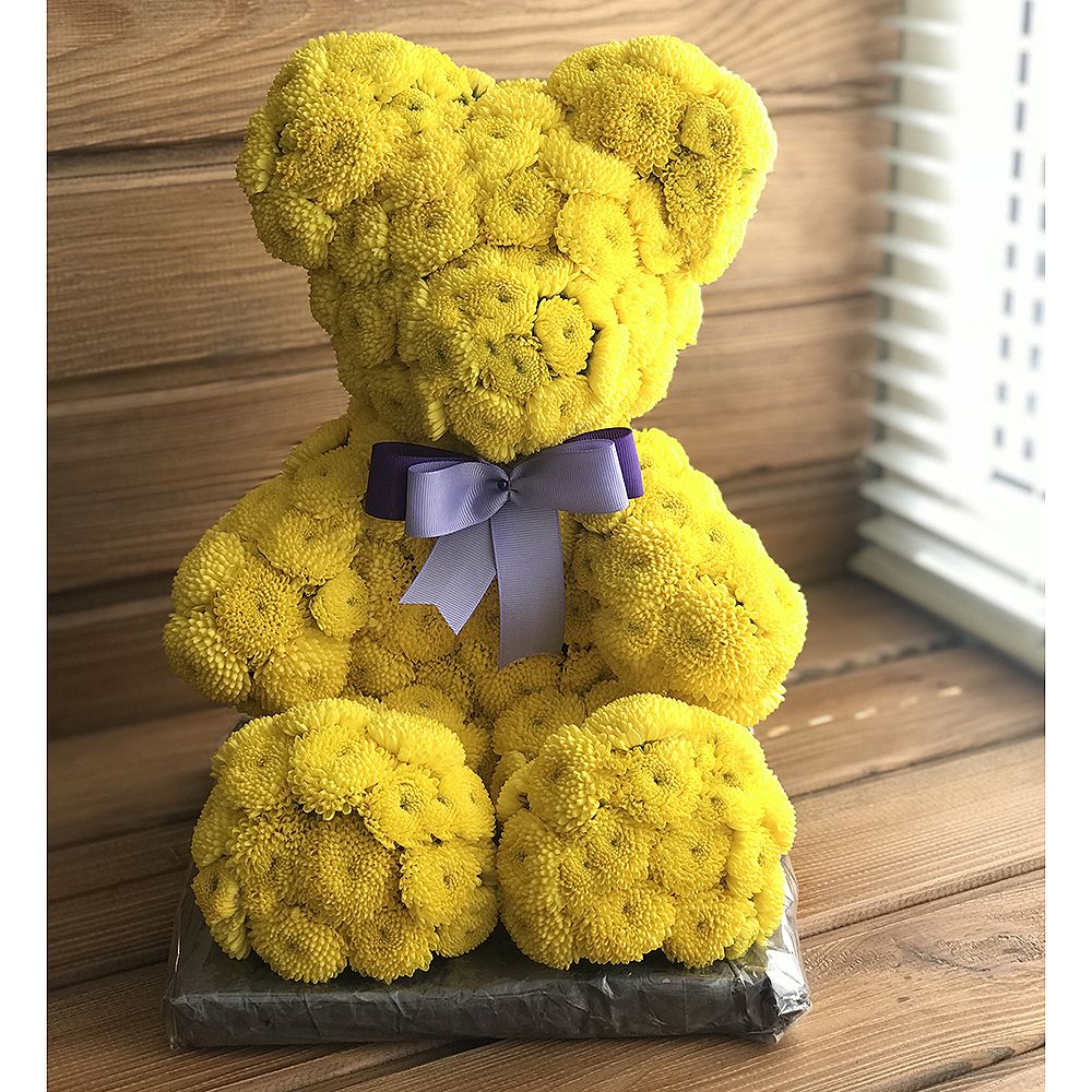 Yellow teddy with a tie-bow