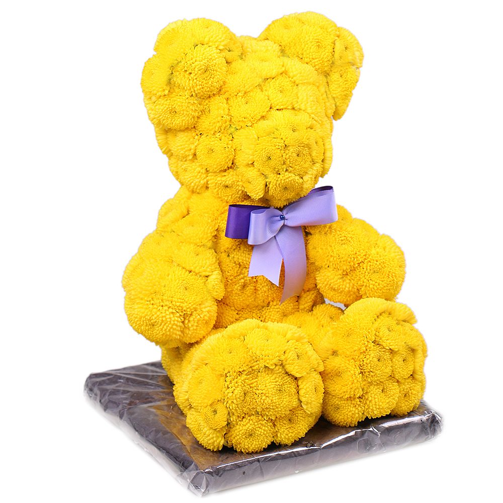 Yellow teddy with a tie-bow Yellow teddy with a tie-bow