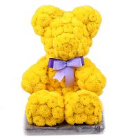 Yellow teddy with a tie-bow