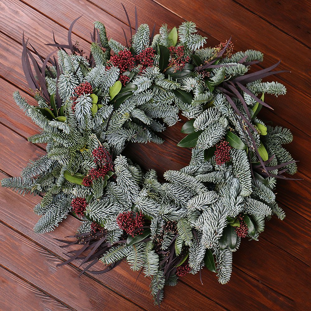 Wreath of fresh spruce and skimmia Wreath of fresh spruce and skimmia